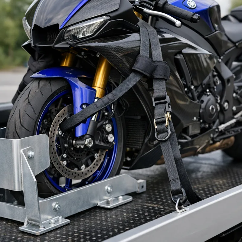 Motorcycle safely secured with soft straps on a recovery truck